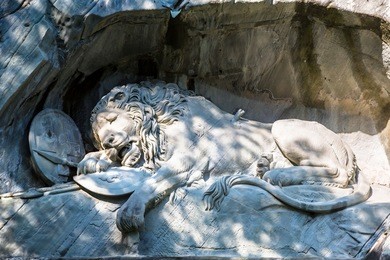 dying lion monument in lucerne in a beautiful summer day, switzerland