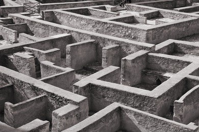 granada in andalusia region of spain. alhambra castle, nasrid palace. unesco world heritage site. building remains looking like a maze. black and white photo.