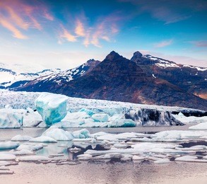 floating ice box on the fjallsarlon glacial lagoon. colorful summer sunrise in vatnajokull national park, southeast iceland, europe. artistic style post processed photo.