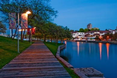 granville island sea walk at night in downtown of vancouver, canada.