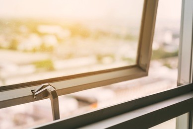sunshine at the window with cityscape view background