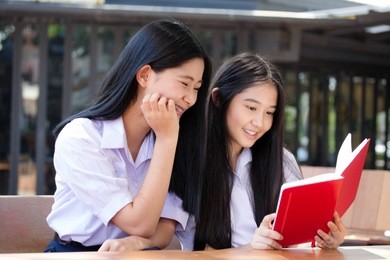 two asia thai high school student uniform best friends beautiful girl reading book