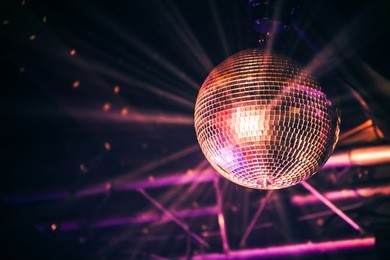 disco ball with bright rays, night party background photo