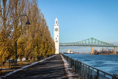 clock tower and jacques cartier bridge at old port - montreal, quebec, canada