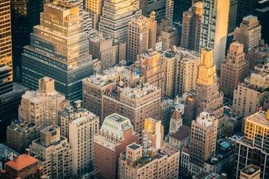 aerial view of the new york city skyline near midtown at sunset