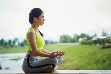 woman yoga - relax in nature