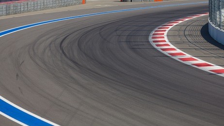 motor racing track. turning asphalt road with marking lines