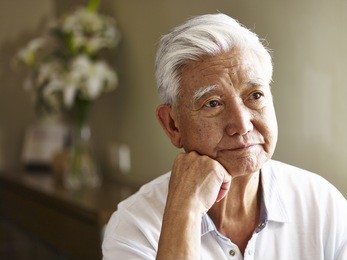 portrait of sad senior asian man hand on chin.