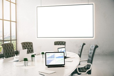 conference room with business chart on laptop screen and empty whiteboard. 3d rendering