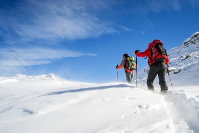 ski mountaineering ascending to the top during a winter snowstorm