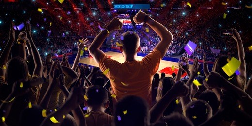 fans on basketball court in game confetti and tinsel