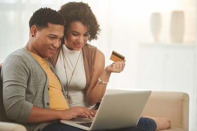 latin-american couple shopping online at home