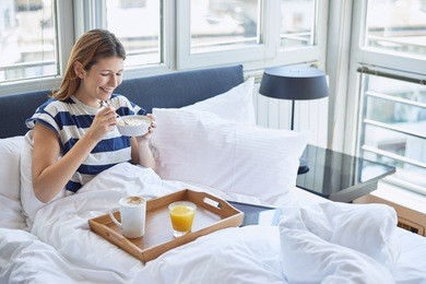breakfast in bed for young beautiful woman