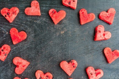 water melon cut into heart shape. space for text. flat lay composition. love concept. valentine's day concept