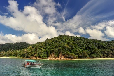 scenic sea view of the kapas island (cotton island) at terengganu, malaysia. clear sea water and blue sky background.