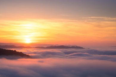 beautiful sunrise view and sea of clouds from phuhuayesan in nong khai provience, thailand.