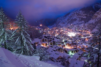 aerial view on zermatt valley and matterhorn peak at dusk with fresh snow in  switzerland