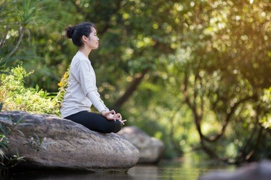 asian woman yoga - relax in nature