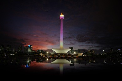 epic sky in blue hour at national monument of indonesia in jakarta. 