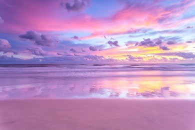 a cotton candy sunrise at the beach