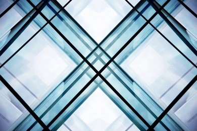 double exposure of modular glass wall / ceiling. transparent modern office building. abstract contemporary architecture.  interior fragment with sky within geometric structure.