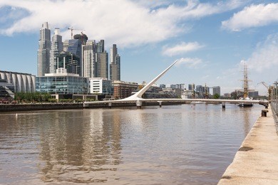 puente de la mujer (woman bridge) and skyscrapers in the puerto madero district in buenos aires (argentina)