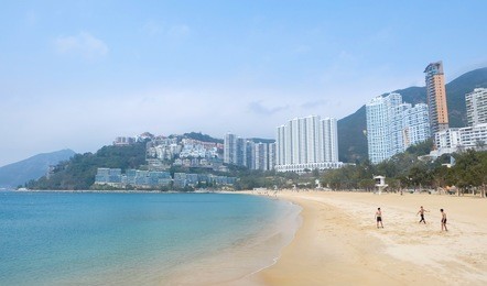 repulse bay beach in hong kong , china : people relaxing at beach