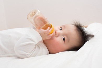 asian baby drinking milk