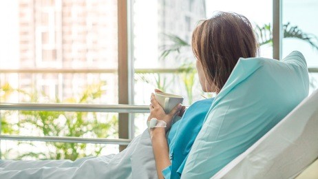 illness asia patient women and hospital concept - illness asian patient women on bed seeing windows in room alone of hospital and copyspace