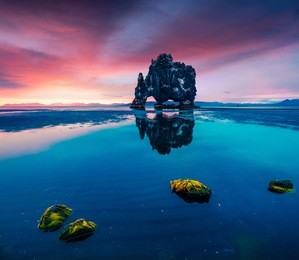 huge basalt stack hvitserkur on the eastern shore of the vatnsnes peninsula. colorful summer sunrise in northwest iceland, europe. artistic style post processed photo.