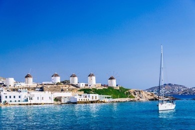 romantic famous windmills of mykonos on a bright summer day, mykonos, cyclades, greece