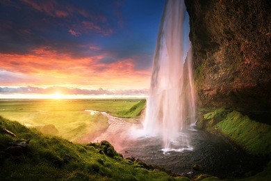 seljalandsfoss waterfall at sunset, iceland