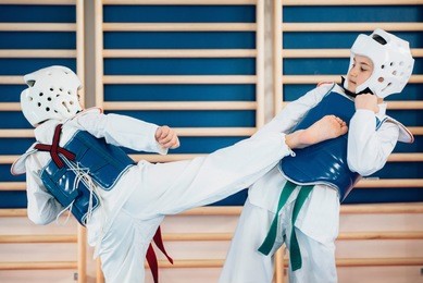 two kids sparing on tae kwon do
