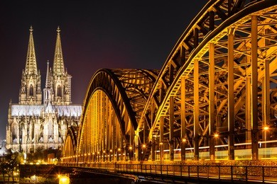 cologne cathedral and hohenzollern bridge at night