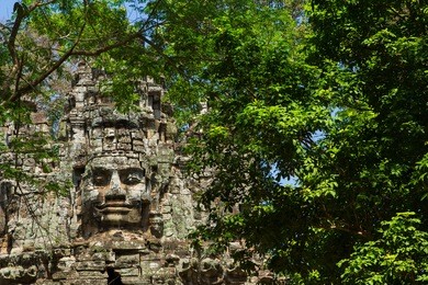 ancient gate of prasat bayon temple, angkor thom , is popular tourist attraction in siem reap, cambodia