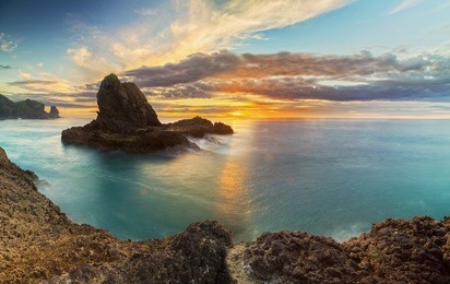 a moody dusk moment at piha beach, west coast auckland new zealand
