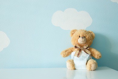 toy bear dressed in diaper