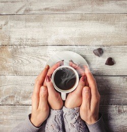 hot coffee in the hands of a loved one.