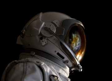astronaut and earth reflections