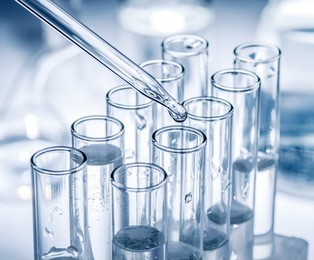 different laboratory beakers and glassware. monochrome.