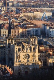 late sunlight on catholic cathedral and place bellecour, lyon, france,