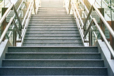 front view of long stairs going up with bright sunlight. 