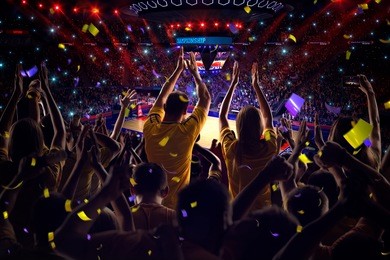 fans on basketball court in game confetti and tinsel