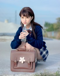 girl student in school uniform japanese style with blue sky