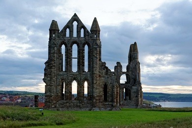 whitby on the north yorkshire coast, england. the ruins of whitby abbey on the east cliff home of caedmon, the earliest recognised english poet, lived.