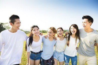 happy young asian group walking together