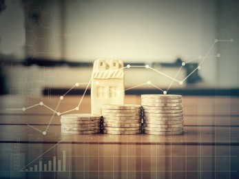 mortgage concept by money house from the coins,business finance and money concept,saving concept to buy a house.