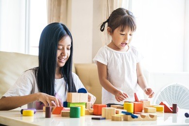 asian happy family kids playing in the room