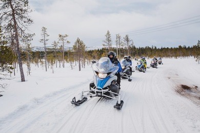 group of snowmobiles on the snow