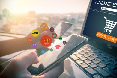 online shopping concept.close-up of hands using touch screen smartphone and holding credit card at home,sunset or sunrise